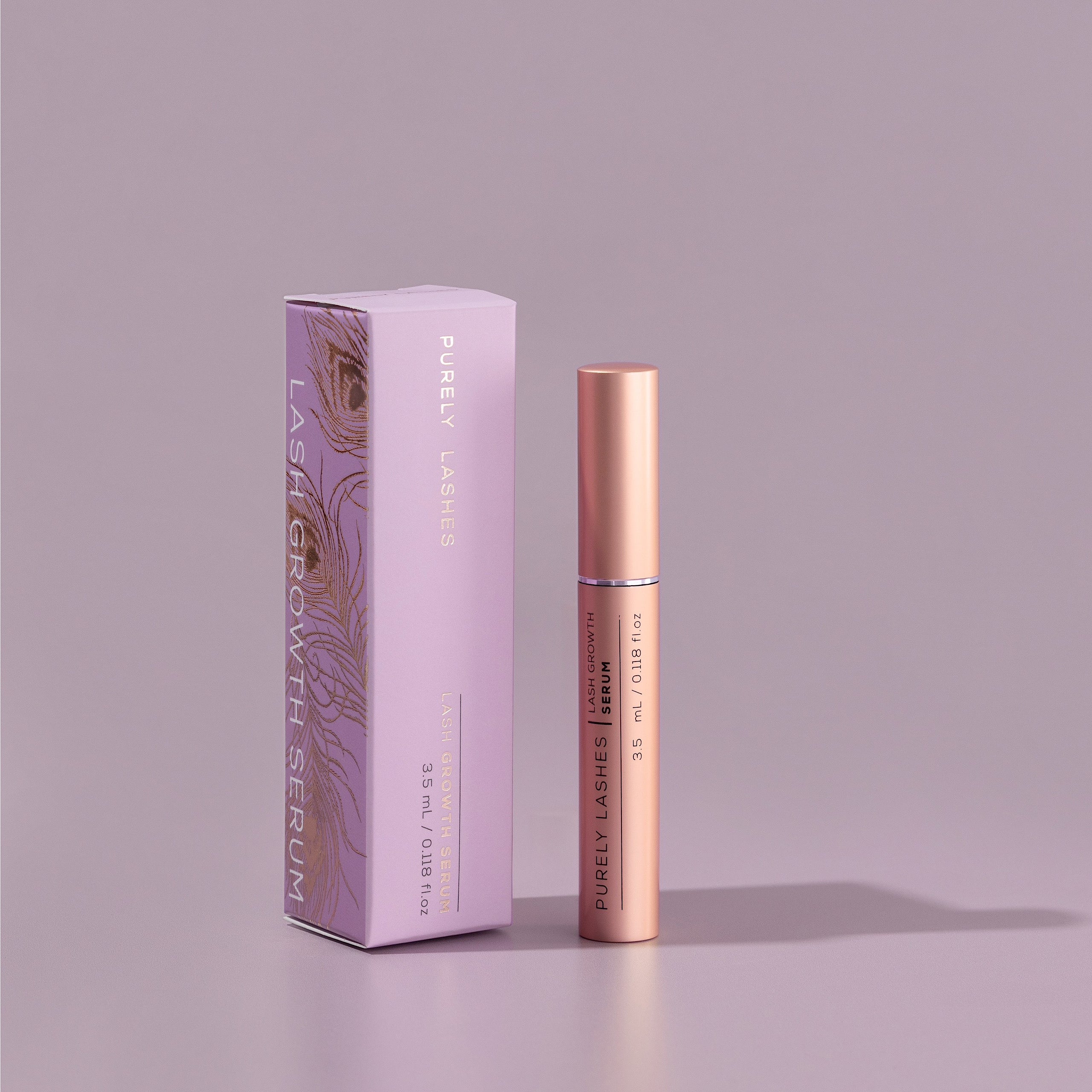 Lash Serum bottle beside the Lash Growth Serum branded box